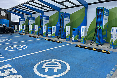 A row of blue Electric Vehicle Charging points