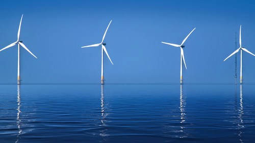 Offshore Wind Turbines Against Clear Blue Sky View more by John Lines from Pexels